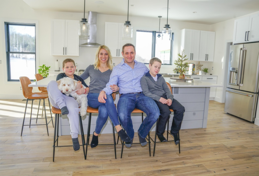 family sitting in modern kitchen home lifestyle Washington DC homebuyer environment