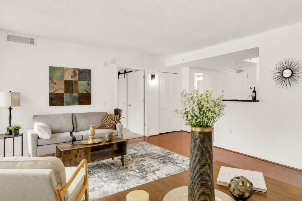 Professionally staged open concept living room at 880 N Pollard Street Arlington Virginia by Harvard Home Services