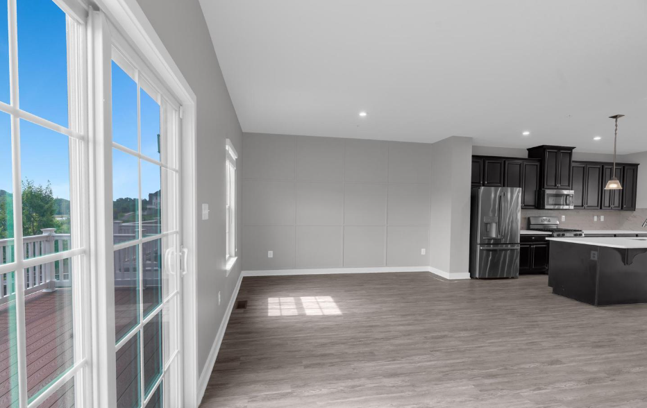 Empty open plan living room and kitchen before staging at 5722 Richmanor Terrace Upper Marlboro Maryland