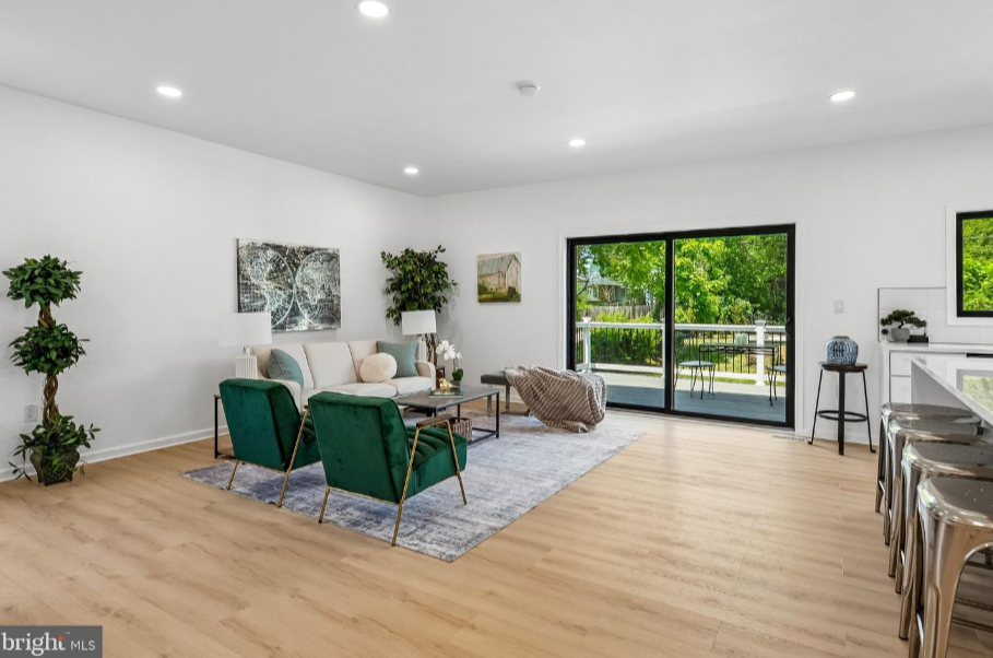 Professionally staged open concept living room with sliding glass doors, home staging DC metro area by Harvard Home Services